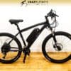 A black electric bike with a sleek frame, a battery mounted on the down tube, and thick tires is displayed against a white background. The EG Kyoto (Demo) model features disc brakes, a comfortable saddle, and a Crazy Lenny's Electric Bikes banner is visible at the top. Demo rides available. A black electric bike with a sleek frame, a battery mounted on the down tube, and thick tires is displayed against a white background. The EG Kyoto (Demo) model features disc brakes, a comfortable saddle, and a Crazy Lenny's Electric Bikes banner is visible at the top. Demo rides available.