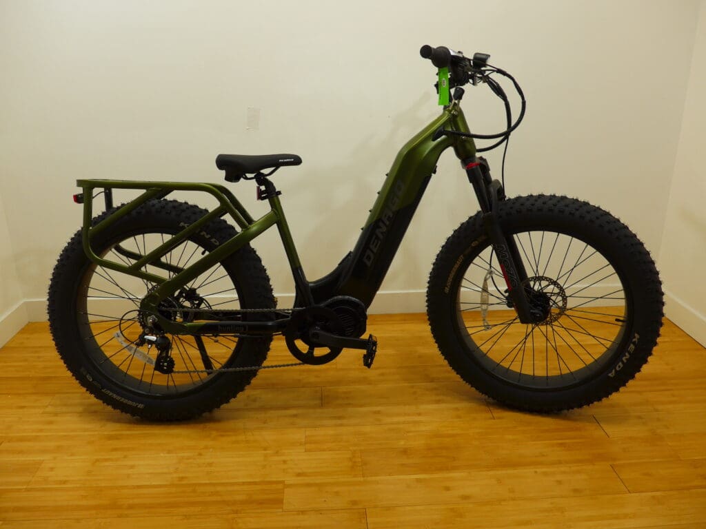 Green fat tire electric bike indoors