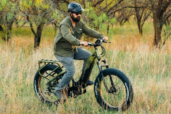 Man riding electric bike in nature trail