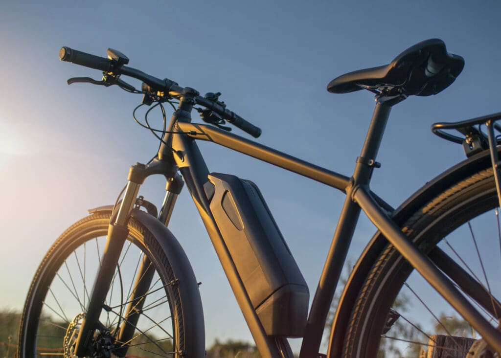 Electric bike in sunlight with battery visible