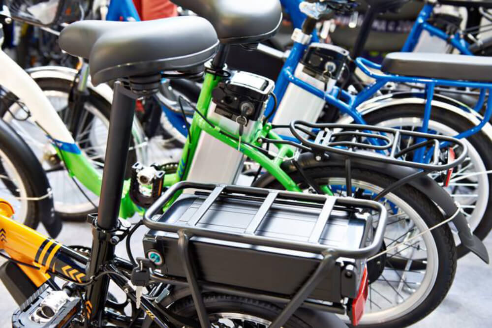 Close-up view of colorful electric bicycles.