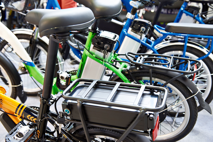 Close-up of colorful electric bicycles in a row.