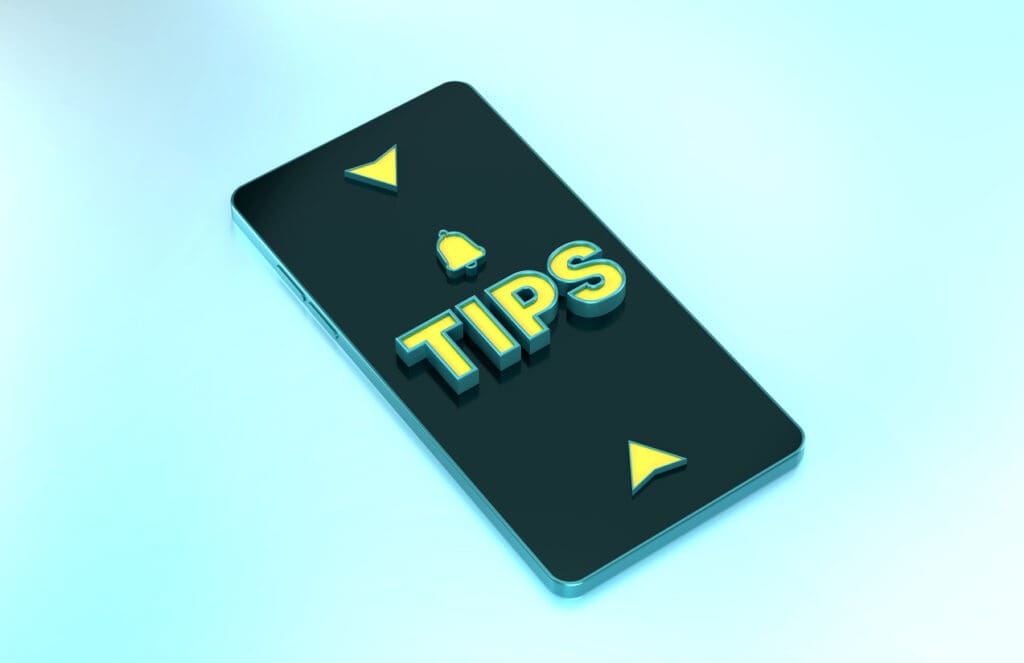 Mobile phone with 'Tips' on screen, arrows shown.