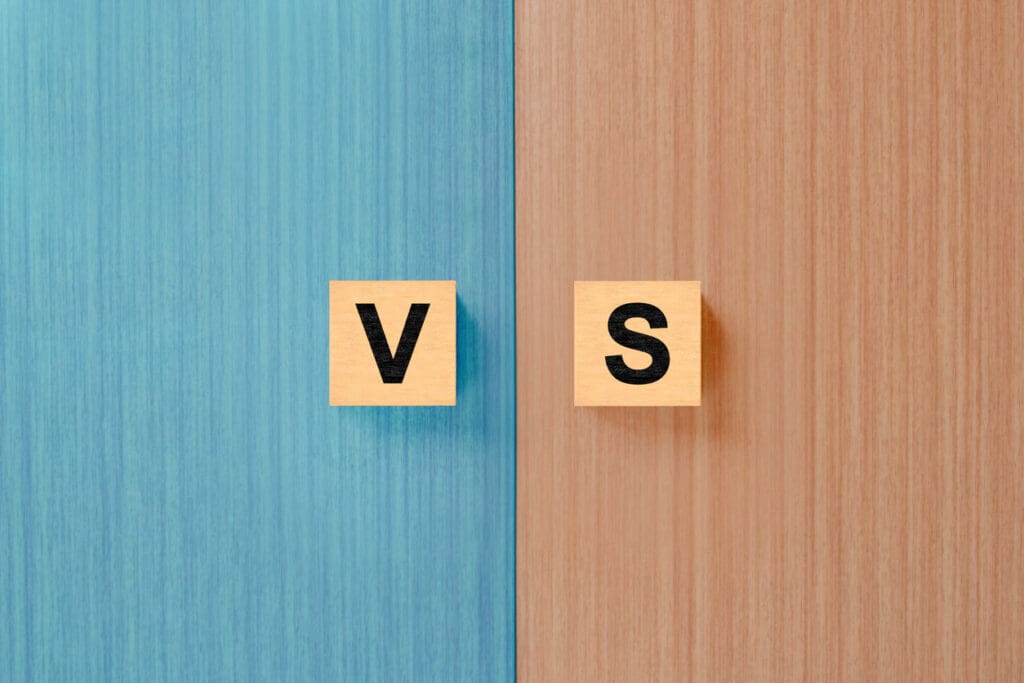 Wooden blocks with letters 'V' and 'S'.