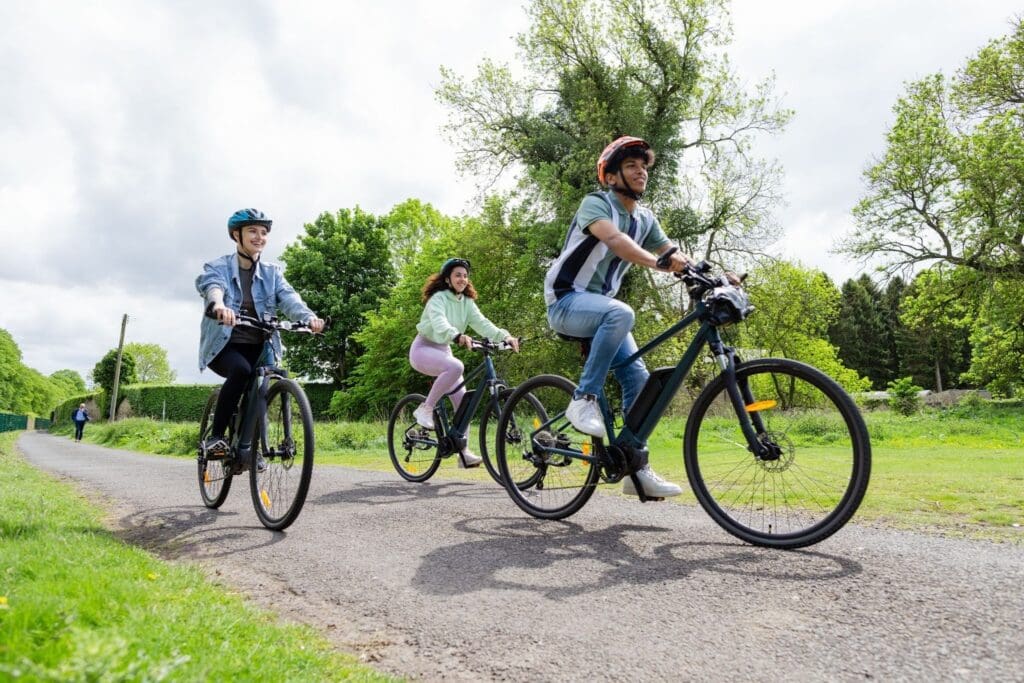 Three people enjoying a bike ride in nature.