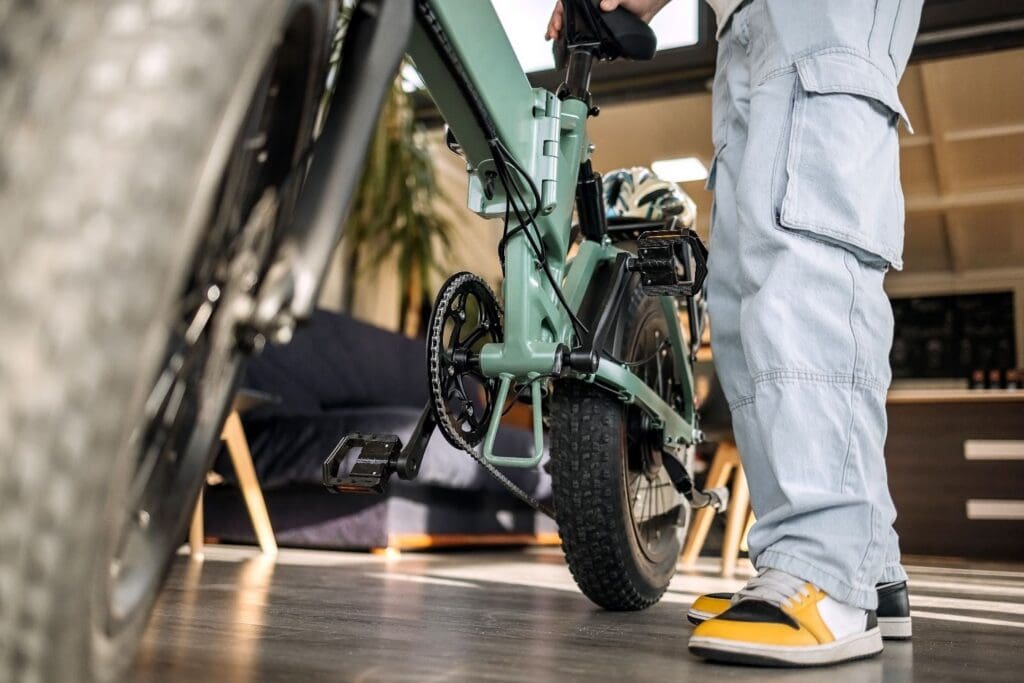 Person with electric bike indoors