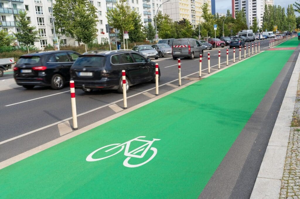 Green bike lane beside busy city road