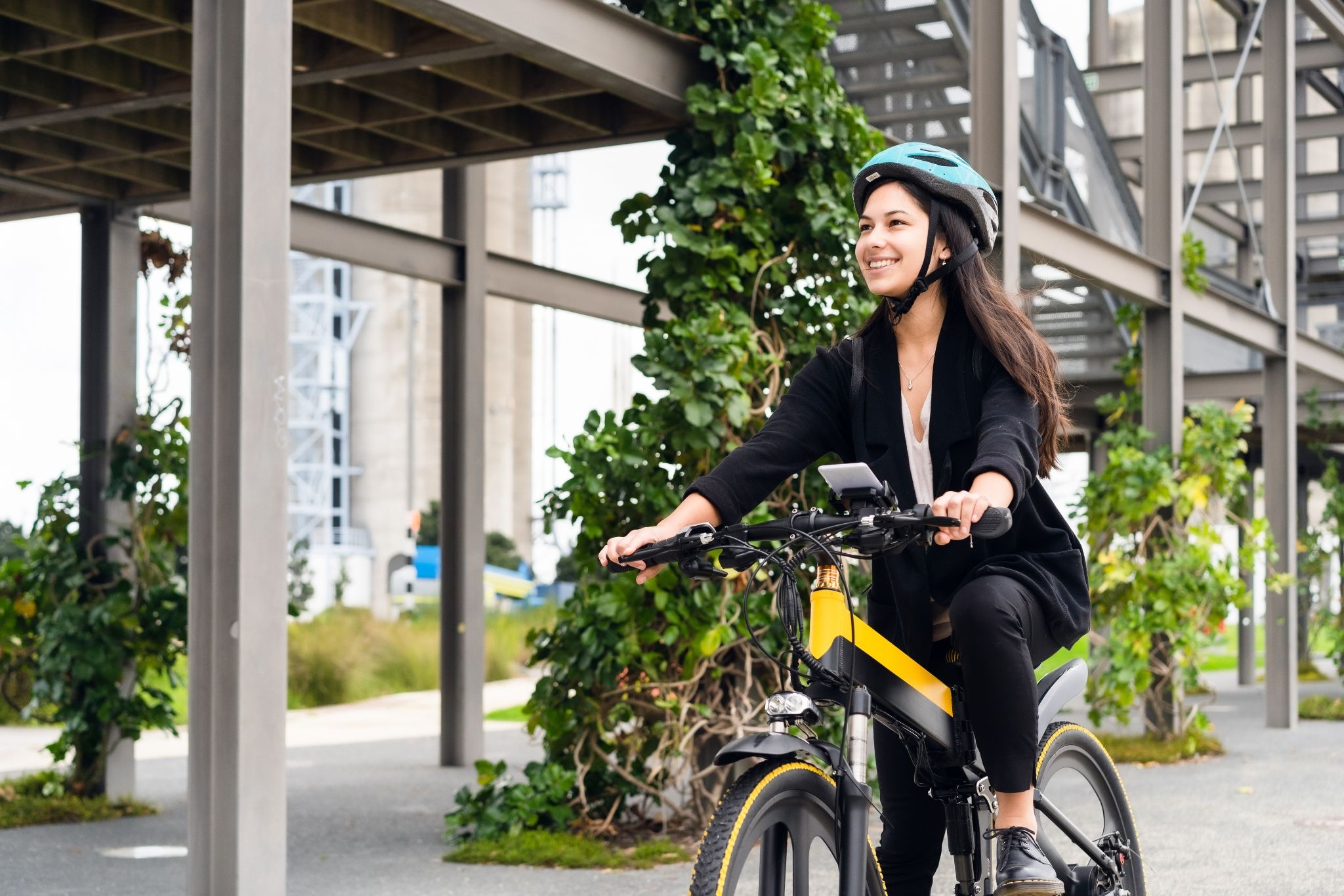Woman riding electric bike in urban setting