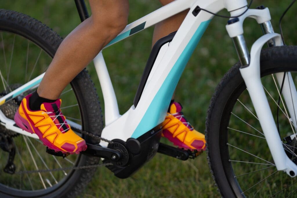 Close-up of person riding electric mountain bike