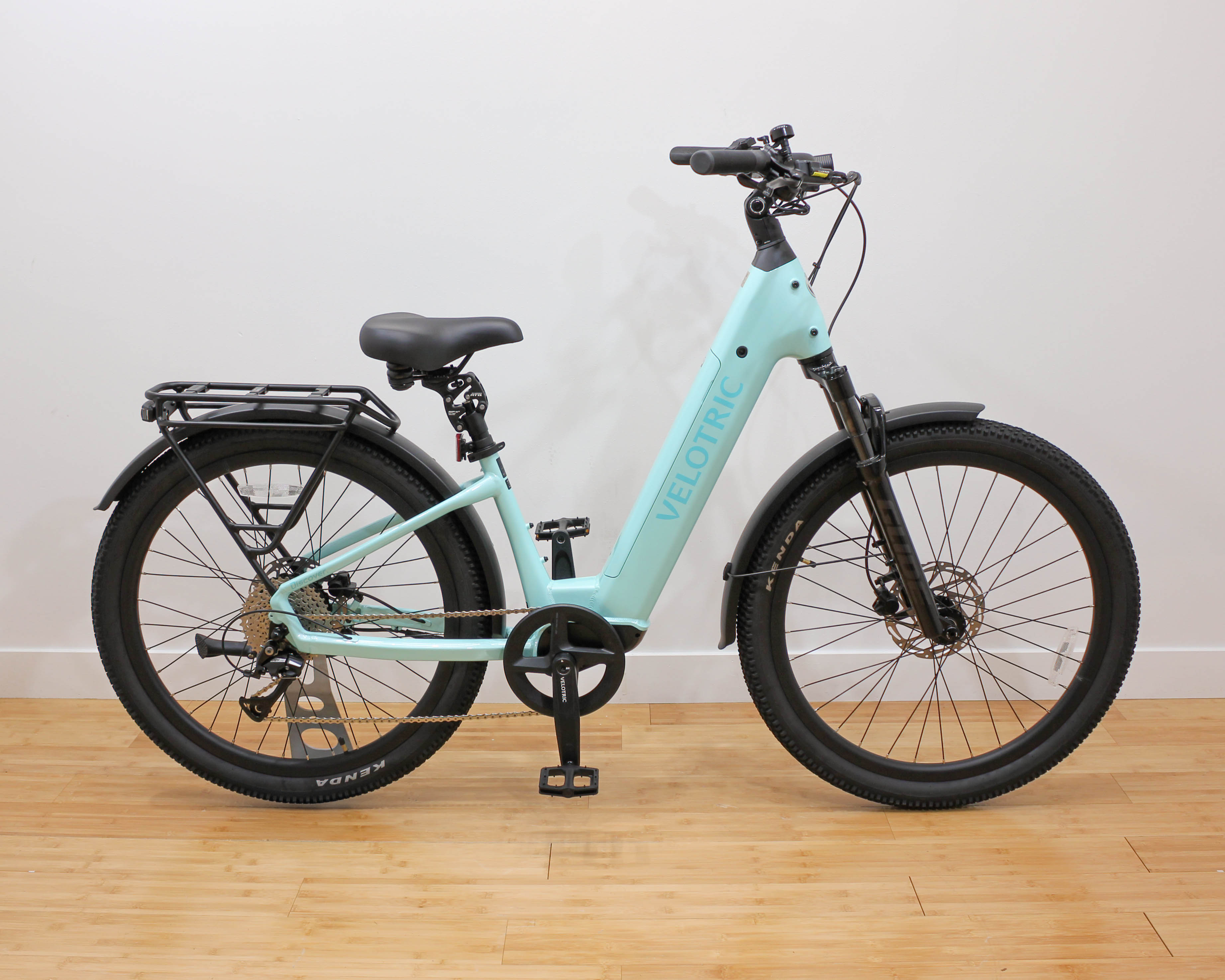Light teal Velotric electric bike with rear rack