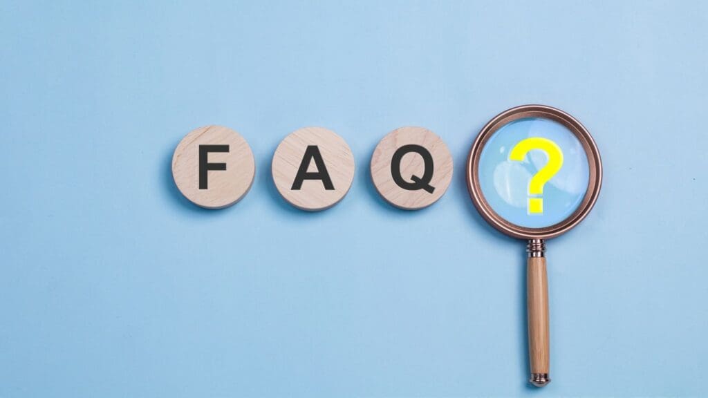 FAQ letters and magnifying glass with question mark